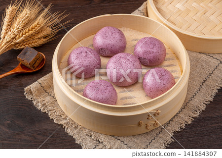 steamed purple sweet potato buns with sweet mashed potato filling steamed purple sweet potato buns with sweet mashed potato filling 141884307
