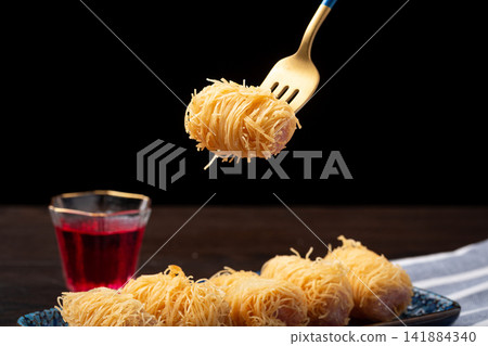 deep fried crispy golden silk taro pastry roll with sweet filling 141884340
