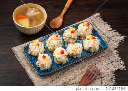 steamed pearl meatballs coated with glutinous rice and lotus root steamed pearl meatballs coated with glutinous rice and lotus root 141884364