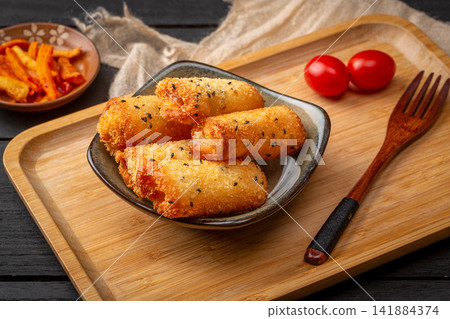deep fried milk pudding rolls with crispy golden breadcrumbs 141884374