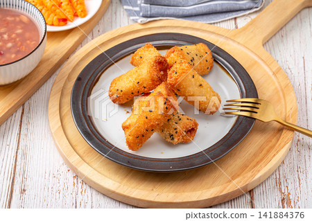 deep fried milk pudding rolls with crispy golden breadcrumbs deep fried milk pudding rolls with crispy golden breadcrumbs 141884376