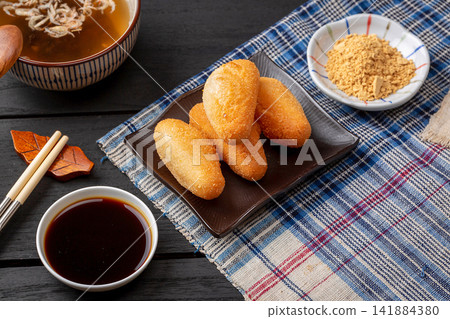 deep fried crispy sticky rice cake rolls with breadcrumbs coating 141884380