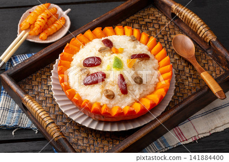 sweet eight treasure glutinous rice served inside a pumpkin shell sweet eight treasure glutinous rice served inside a pumpkin shell 141884400