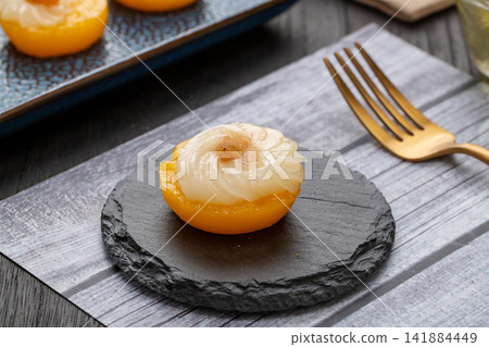 sweet mango pudding rice cakes topped with coconut cream and raisins sweet mango pudding rice cakes topped with coconut cream and raisins 141884449