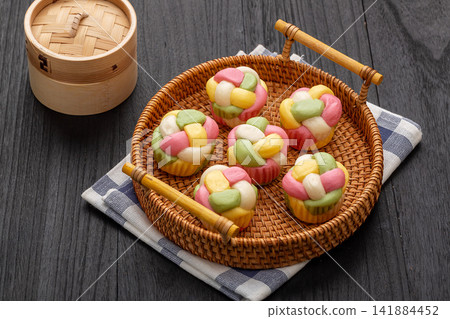 artisanal hydrangea flower shaped steamed buns with colorful dough strands artisanal hydrangea flower shaped steamed buns with colorful dough strands 141884452
