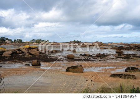 Wide tidal flats near Mean Ruz lighthouse on Tregastel coast, Brittany, France Wide tidal flats near Mean Ruz lighthouse on Tregastel coast, Brittany, France 141884954