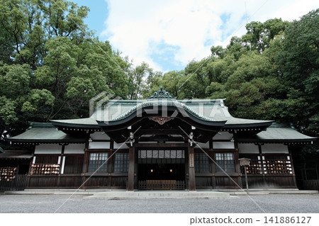 The shrine building of Kami-Chigama Shrine, a subsidiary shrine of Nagoya's Atsuta Shrine, stands amidst a lush green forest and is revered as the god of wisdom. The shrine building of Kami-Chigama Shrine, a subsidiary shrine of Nagoya's Atsuta Shrine, stands amidst a lush green forest and is revered as the god of wisdom. 141886127