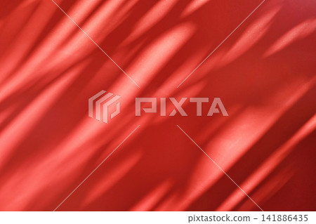 Vibrant red surface with natural shadow and light overlay texture for professional abstract design background. Vibrant red surface with natural shadow and light overlay texture for professional abstract design background. 141886435