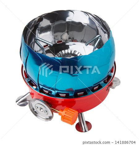 Folded portable camping gas stove with wind shield isolated on white background. Compact hiking burner stove with blue protective film Folded portable camping gas stove with wind shield isolated on white background. Compact hiking burner stove with blue protective film 141886704