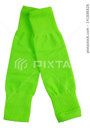 Pair of bright neon green footless soccer socks isolated on white background. Athletic leg sleeves for shin guards studio shot Pair of bright neon green footless soccer socks isolated on white background. Athletic leg sleeves for shin guards studio shot 141886826