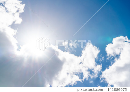 The midsummer sun peeks out from a break in the clouds. The midsummer sun peeks out from a break in the clouds. 141886975