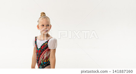 Portrait of child with cochlear implant during dance practice in studio. Banner with copy space. Hearing loss treatment, auditory rehabilitation, assistive medical device, emotional adaptation, and Portrait of child with cochlear implant during dance practice in studio. Banner with copy space. Hearing loss treatment, auditory rehabilitation, assistive medical device, emotional adaptation, and 141887160