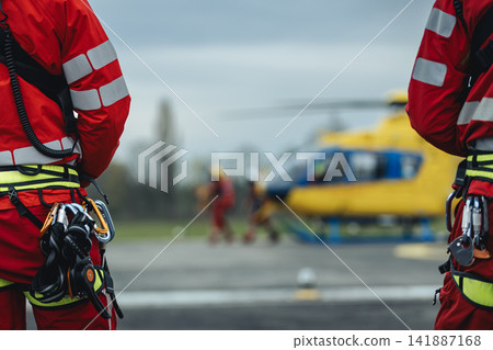 Team of helicopter emergency medical service on helipad Team of helicopter emergency medical service on helipad 141887168