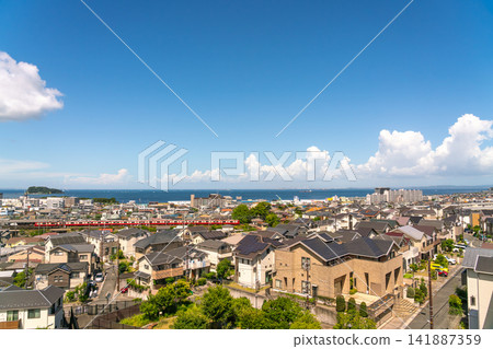 Kanagawa Prefecture: A view of a Japanese urban landscape – a residential area in Yokosuka along the coast under a bright summer sky (August 2026) Kanagawa Prefecture: A view of a Japanese urban landscape – a residential area in Yokosuka along the coast under a bright summer sky (August 2026) 141887359