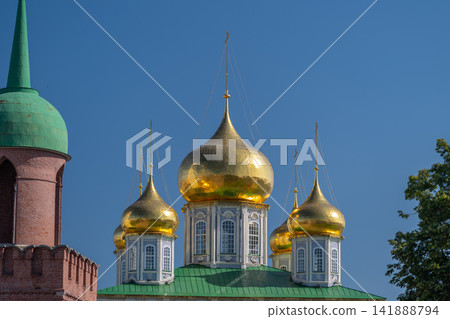 Golden domes shine brilliantly under the clear blue sky at the Cathedral of the Assumption in Tula Russia Golden domes shine brilliantly under the clear blue sky at the Cathedral of the Assumption in Tula Russia 141888794