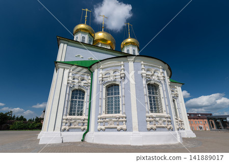 Majestic architecture of the Cathedral of the Assumption in Tula capturing golden domes under a clear blue sky 141889017