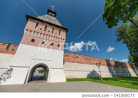 Explore the historical charm of Tula Kremlin Museum under a bright blue sky with lush greenery surrounding ancient walls Explore the historical charm of Tula Kremlin Museum under a bright blue sky with lush greenery surrounding ancient walls 141889173