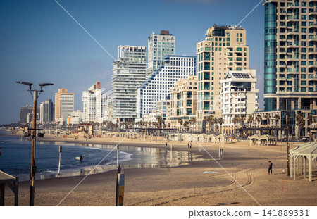 Modern hotel skyline and Mediterranean coastline seen from the Charles Clore promenade in Tel Aviv Modern hotel skyline and Mediterranean coastline seen from the Charles Clore promenade in Tel Aviv 141889331