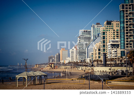 Modern hotel skyline and Mediterranean coastline seen from the Charles Clore promenade in Tel Aviv Modern hotel skyline and Mediterranean coastline seen from the Charles Clore promenade in Tel Aviv 141889333