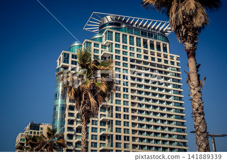 Modern hotel skyline and Mediterranean coastline seen from the Charles Clore promenade in Tel Aviv Modern hotel skyline and Mediterranean coastline seen from the Charles Clore promenade in Tel Aviv 141889339