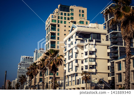 Modern hotel skyline and Mediterranean coastline seen from the Charles Clore promenade in Tel Aviv Modern hotel skyline and Mediterranean coastline seen from the Charles Clore promenade in Tel Aviv 141889340