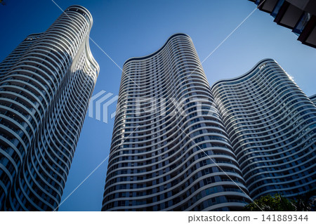 Modern urban skyline featuring a dense cluster of high-rise corporate architecture in Tel Aviv Modern urban skyline featuring a dense cluster of high-rise corporate architecture in Tel Aviv 141889344