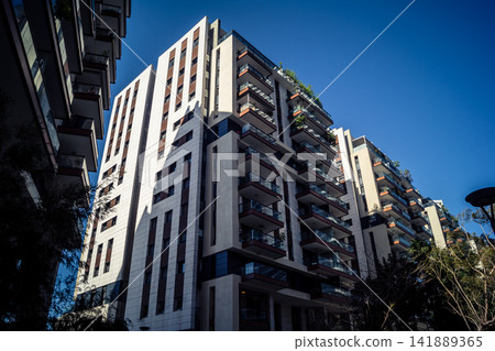 Modern urban skyline featuring a dense cluster of high-rise corporate architecture in Tel Aviv Modern urban skyline featuring a dense cluster of high-rise corporate architecture in Tel Aviv 141889365