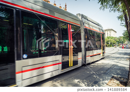 Seville Metrocentro tramway circulating through urban avenues in Andalusia Seville Metrocentro tramway circulating through urban avenues in Andalusia 141889384