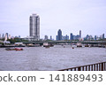 View of motorboats and passenger boats navigating the Chao Phraya River near Memorial Bridge 141889493