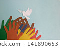 Many colorful paper hands reaching out to a paper dove of peace on a blue background. World Peace Day. Place for your text 141890653