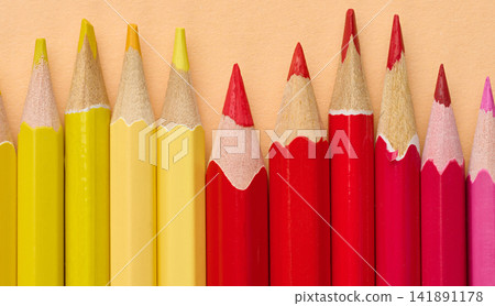 Multicolored wooden pencils in a row, drawing and creativity tools Multicolored wooden pencils in a row, drawing and creativity tools 141891178