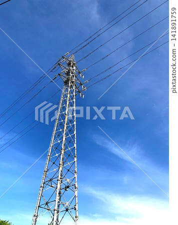 A transmission tower on a hot summer day A transmission tower on a hot summer day 141891759