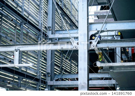 The complex steel frame structure of a multi-story parking garage The complex steel frame structure of a multi-story parking garage 141891760