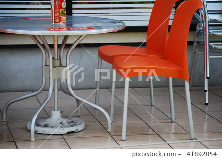 Tables and chairs placed on the terrace 141892054