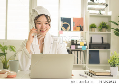 Young Asian Woman Working Online, Relaxing and Practicing Self Care During Daily Life at Home Young Asian Woman Working Online, Relaxing and Practicing Self Care During Daily Life at Home 141893633