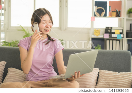 Young Asian Woman Working Online, Relaxing and Practicing Self Care During Daily Life at Home Young Asian Woman Working Online, Relaxing and Practicing Self Care During Daily Life at Home 141893665