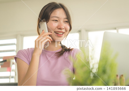 Young Asian Woman Working Online, Relaxing and Practicing Self Care During Daily Life at Home Young Asian Woman Working Online, Relaxing and Practicing Self Care During Daily Life at Home 141893666