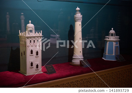 Lighthouse models on display in Tangier museum showcasing historic coastal beacons and architecture Lighthouse models on display in Tangier museum showcasing historic coastal beacons and architecture 141893729