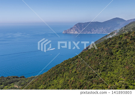Cinque Terre in Liguria, Italy with boat wake within layered natural coastal scenery Cinque Terre in Liguria, Italy with boat wake within layered natural coastal scenery 141893803
