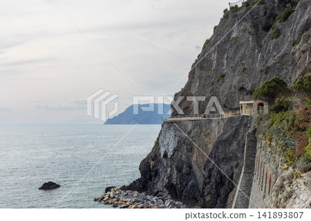 Via dell Amore along the Cinque Terre coast in Italy from telephoto oblique coastal perspective Via dell Amore along the Cinque Terre coast in Italy from telephoto oblique coastal perspective 141893807