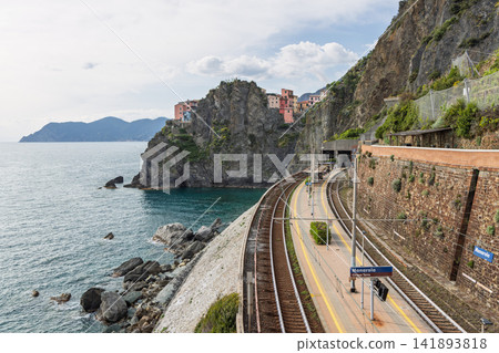 Railway station in Manarola, Italy from elevated perspective centered down the tracks Railway station in Manarola, Italy from elevated perspective centered down the tracks 141893818