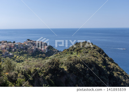Corniglia in northwest Italy from elevated wide perspective on the coastal trail Corniglia in northwest Italy from elevated wide perspective on the coastal trail 141893839