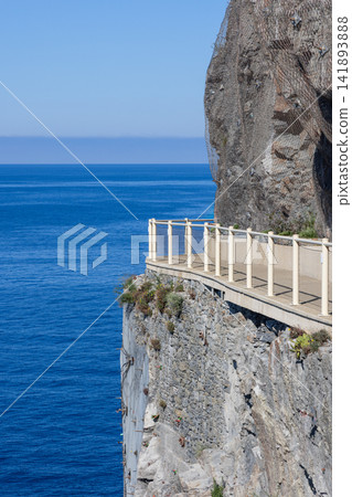 Via dell Amore at Cinque Terre in Liguria, Italy with empty path projecting from sheer cliff Via dell Amore at Cinque Terre in Liguria, Italy with empty path projecting from sheer cliff 141893888