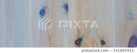 Panoramic background of vertical light wooden boards with subtle blue tint and natural dark knots for modern rustic interior design or web header banner Panoramic background of vertical light wooden boards with subtle blue tint and natural dark knots for modern rustic interior design or web header banner 141893913