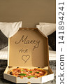 A romantic proposal of love with delicious pizza and the inscription on the box of Merry Me 141894241