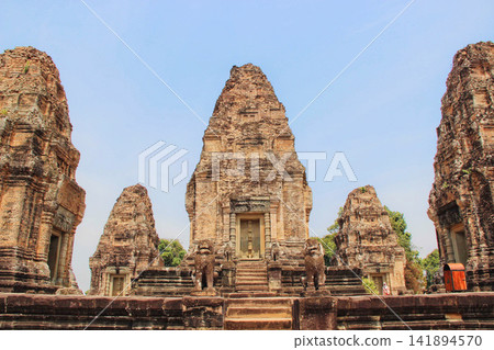Ancient Khmer Temple Ruins in Cambodia Under Blue Sky Ancient Khmer Temple Ruins in Cambodia Under Blue Sky 141894570