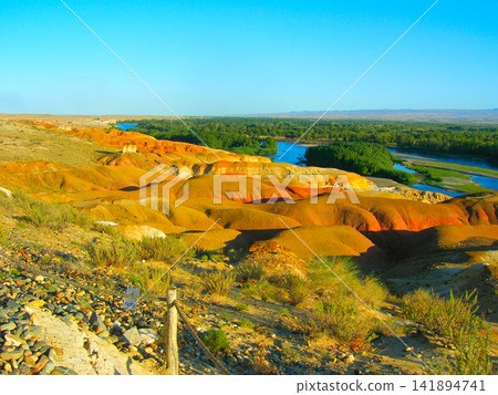 Colorful Badlands Landscape with River Oasis and Desert Hills Colorful Badlands Landscape with River Oasis and Desert Hills 141894741