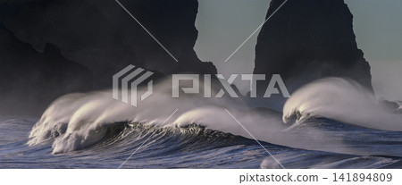 Dramatic Ocean Waves Crashing Against Dark Sea Cliffs Dramatic Ocean Waves Crashing Against Dark Sea Cliffs 141894809