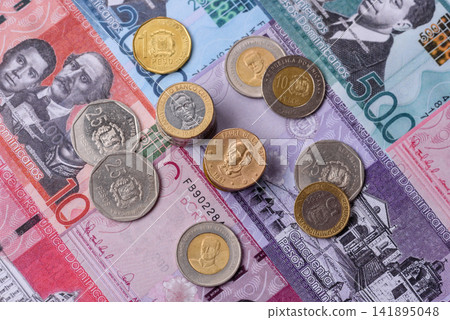 Dominican peso banknotes and coins as a instrument of trade and exchange. Dominican peso Dominican peso banknotes and coins as a instrument of trade and exchange. Dominican peso 141895048
