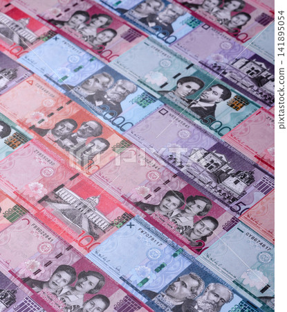 Dominican peso banknotes and coins as a instrument of trade and exchange. Dominican peso Dominican peso banknotes and coins as a instrument of trade and exchange. Dominican peso 141895054